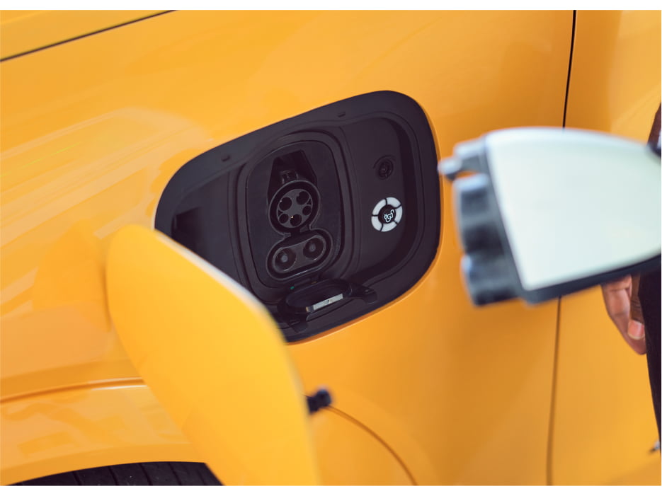 Close up of plug and car's charging port