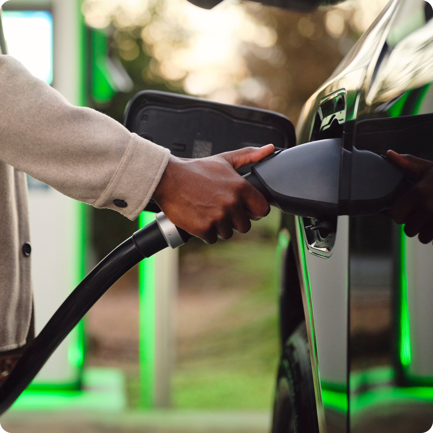 Person plugging an EV charger into their vehicle