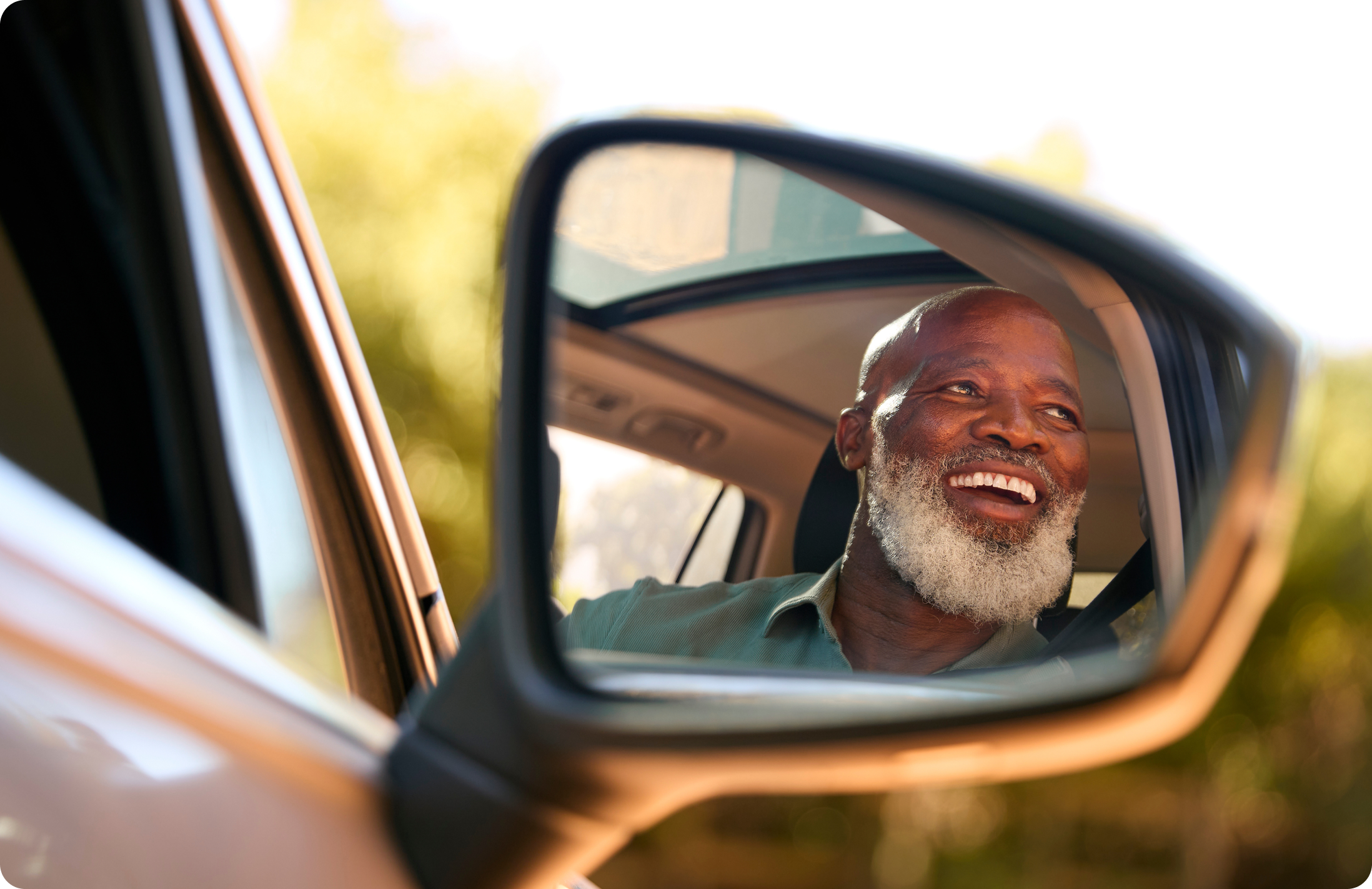 Happy man in a car