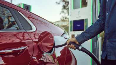 Close up of a Hyundai charger port with an Electrify America charger