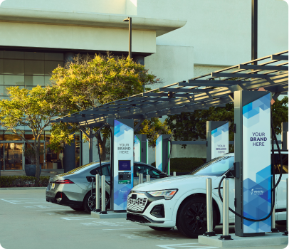 Woman plugging in an electric vehicle
